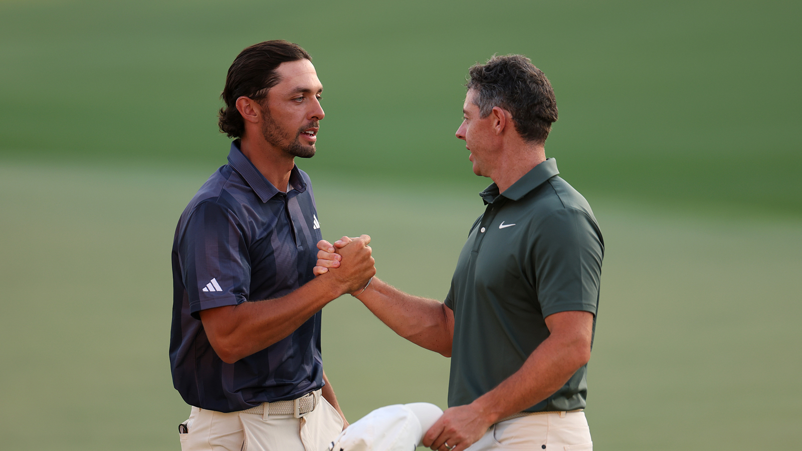 Marco Penge and Rory McIlroy shake hands
