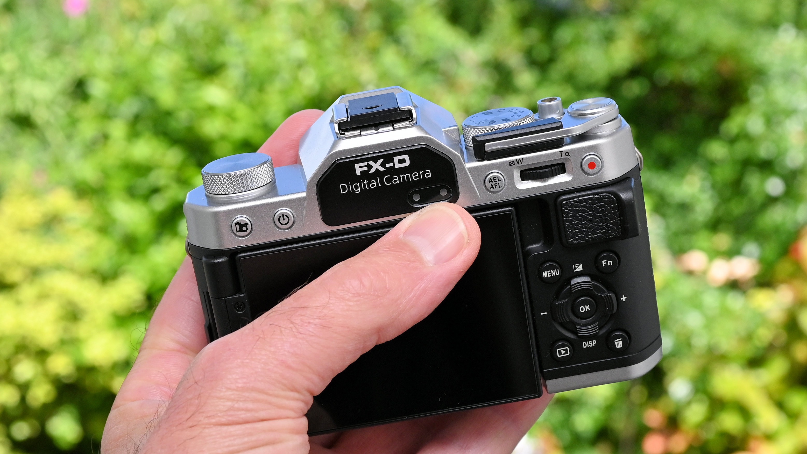 Yashica FX-D 300 product shot, camera held in hand