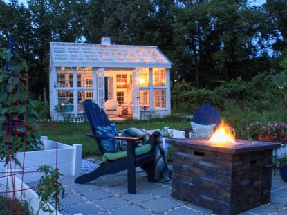 A Fire Pit On A Backyard Patio Area