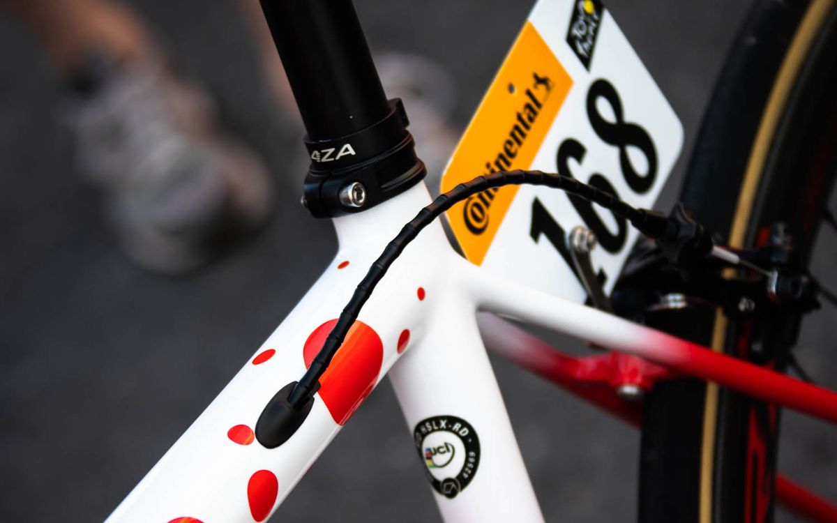 The polka-dot design changes from a white to red fade at the rear of the bike