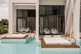 Guestrooms by swimming pool at Casa Cook hotel, Rhodes