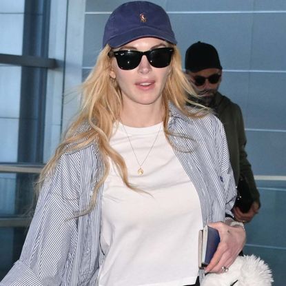 Lindsay Lohan was spotted at JFK airport in chunky white On sneakers