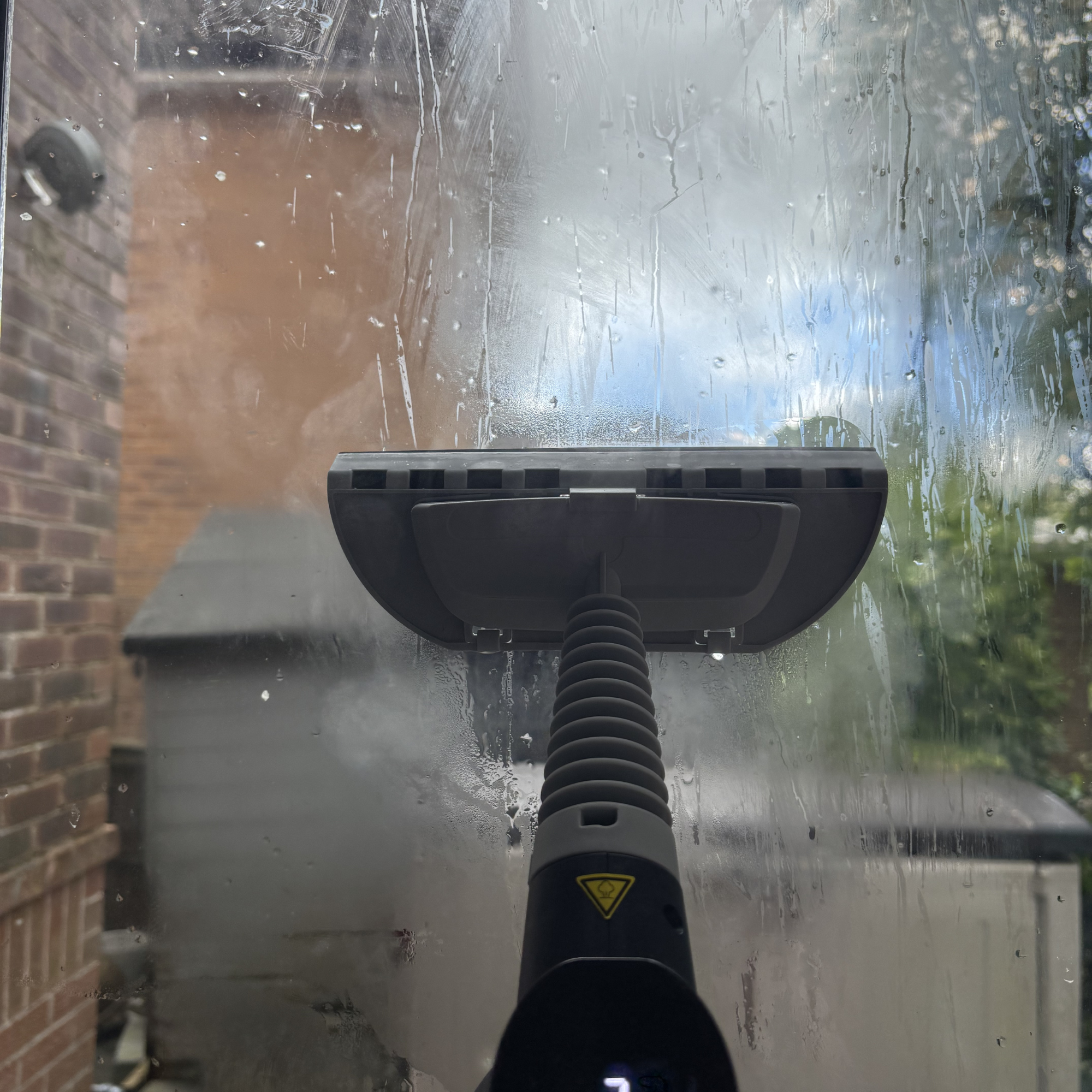 Beldray Digital Handheld Steam Cleaner to clean windows