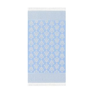 A blue and white patterned beach towel