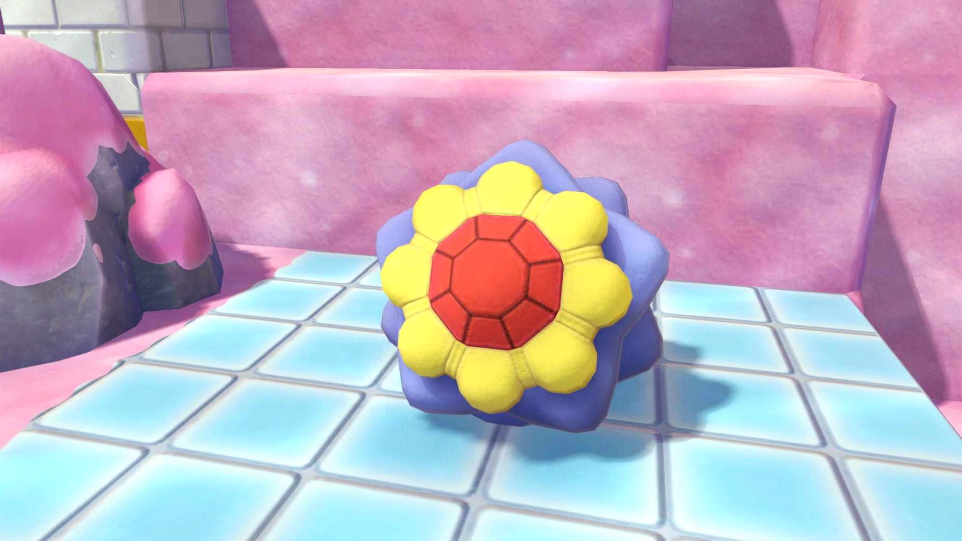 The Pokopia Starmie Doll sits on the floor in Bubbly Basin.
