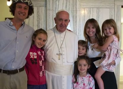 Pope Francis embraces the "crazy" family that drove to see him from Argentina