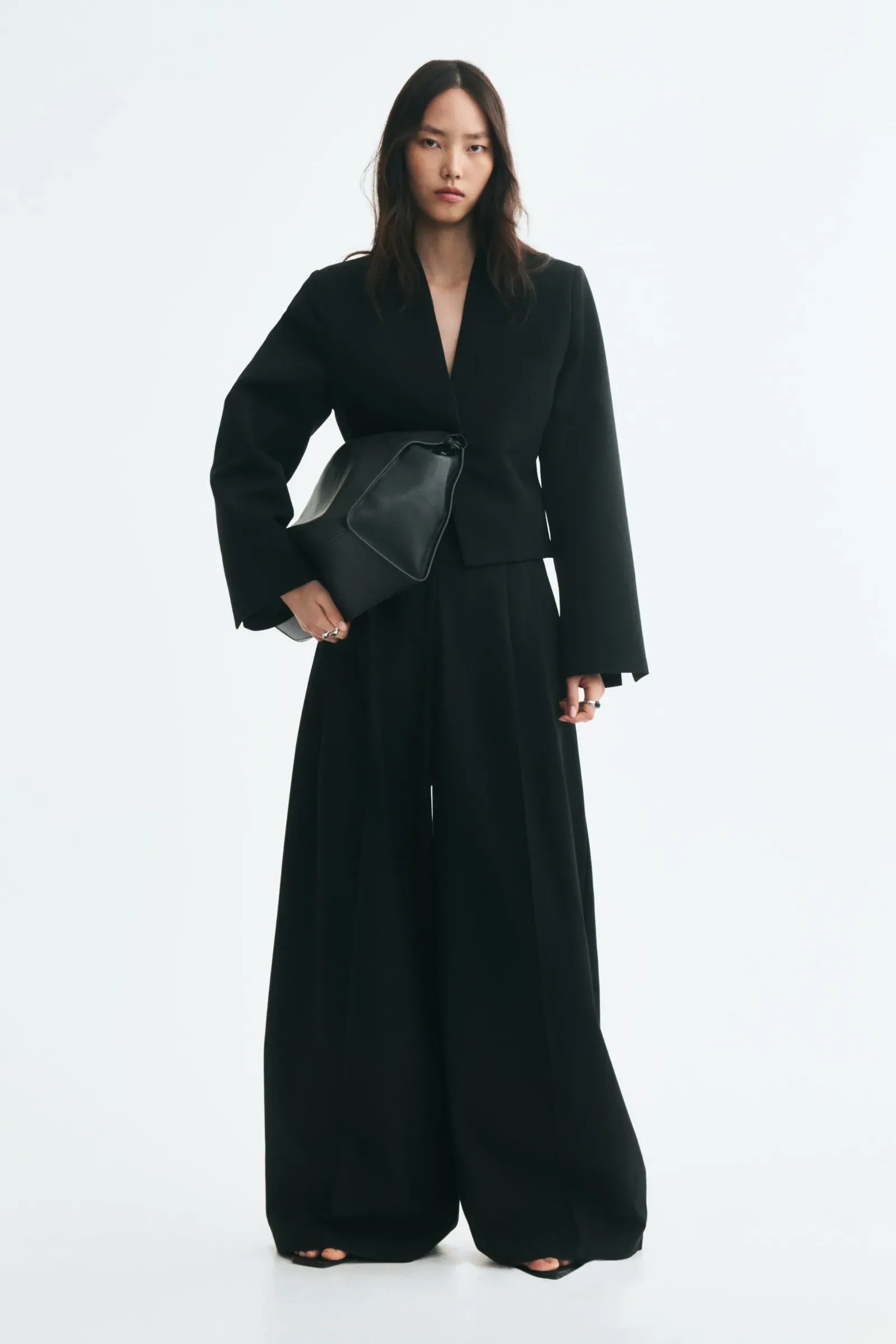 Woman wears black blazer and black trouser