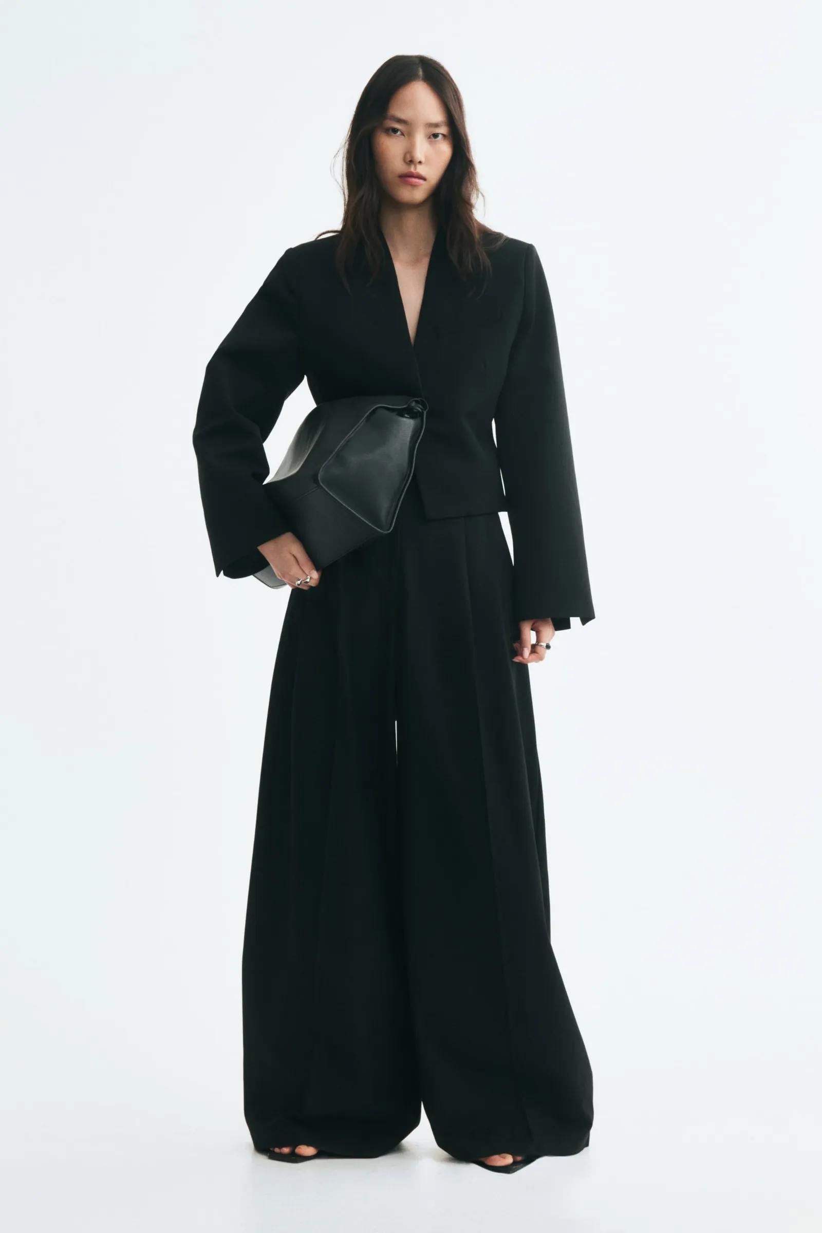 Woman wears black blazer and black trouser