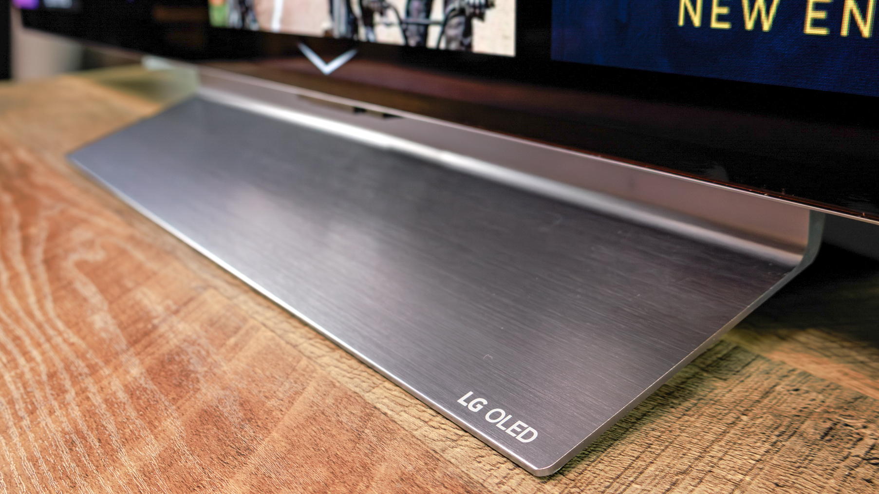 LG C6 OLED TV shown on a wood table