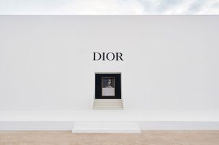 White wall with central Dior picture frame