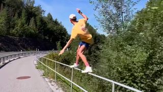 Andri Ragletti skiing on a guardrail