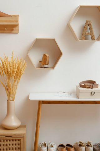 Dried flowers next to a shoe rack