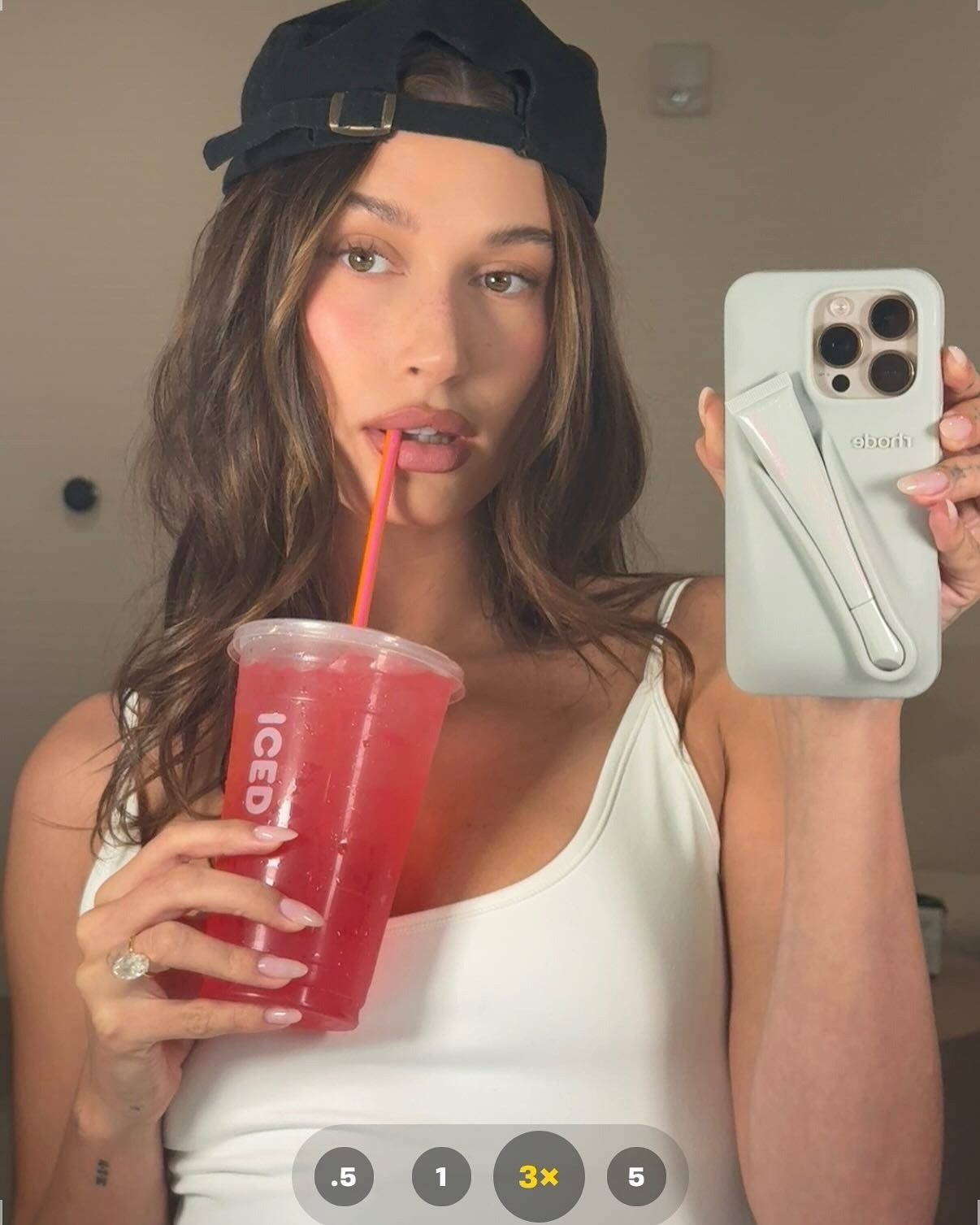 Hailey Bieber wearing the soft serve nail trend