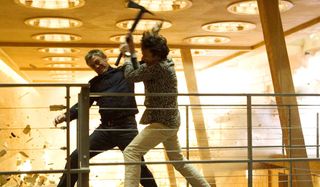 Quantum Of Solace Bond and Greene fight on a walkway in a burning hotel