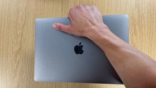 My massive arm holding the small MacBook Air.