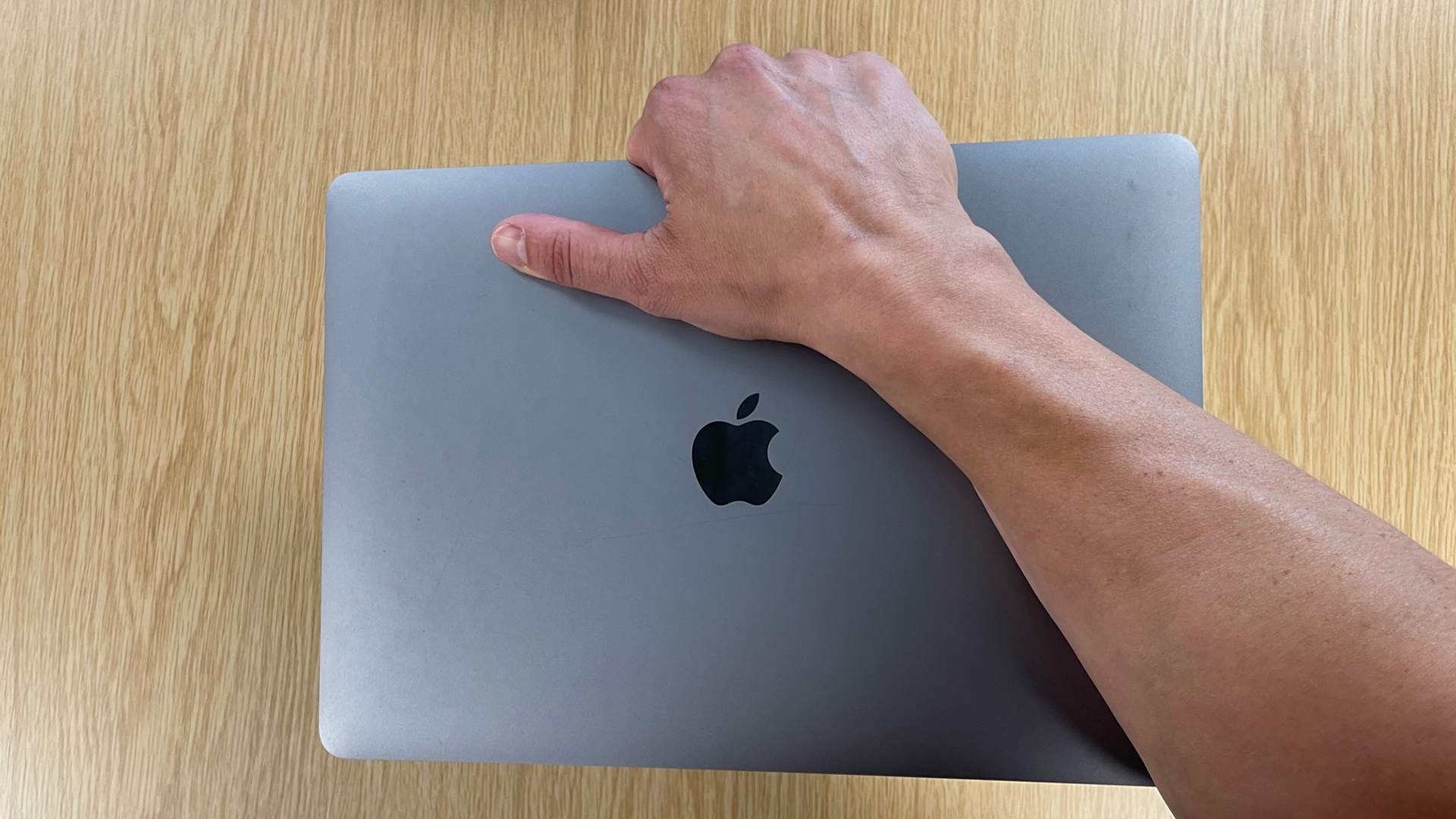 My massive arm holding the small MacBook Air.