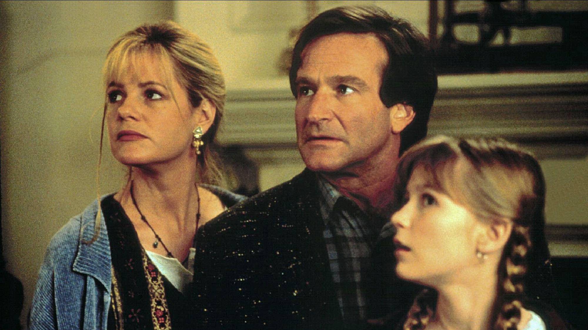 Bonnie Hunt as Sarah Whittle, Robin Williams as Alan Parrish and Kirsten Dunst as Judy Shepherd in Jumanji