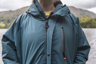 woman wearing Red Alter Evo standing on the banks of Grasmere lake in the Lake District