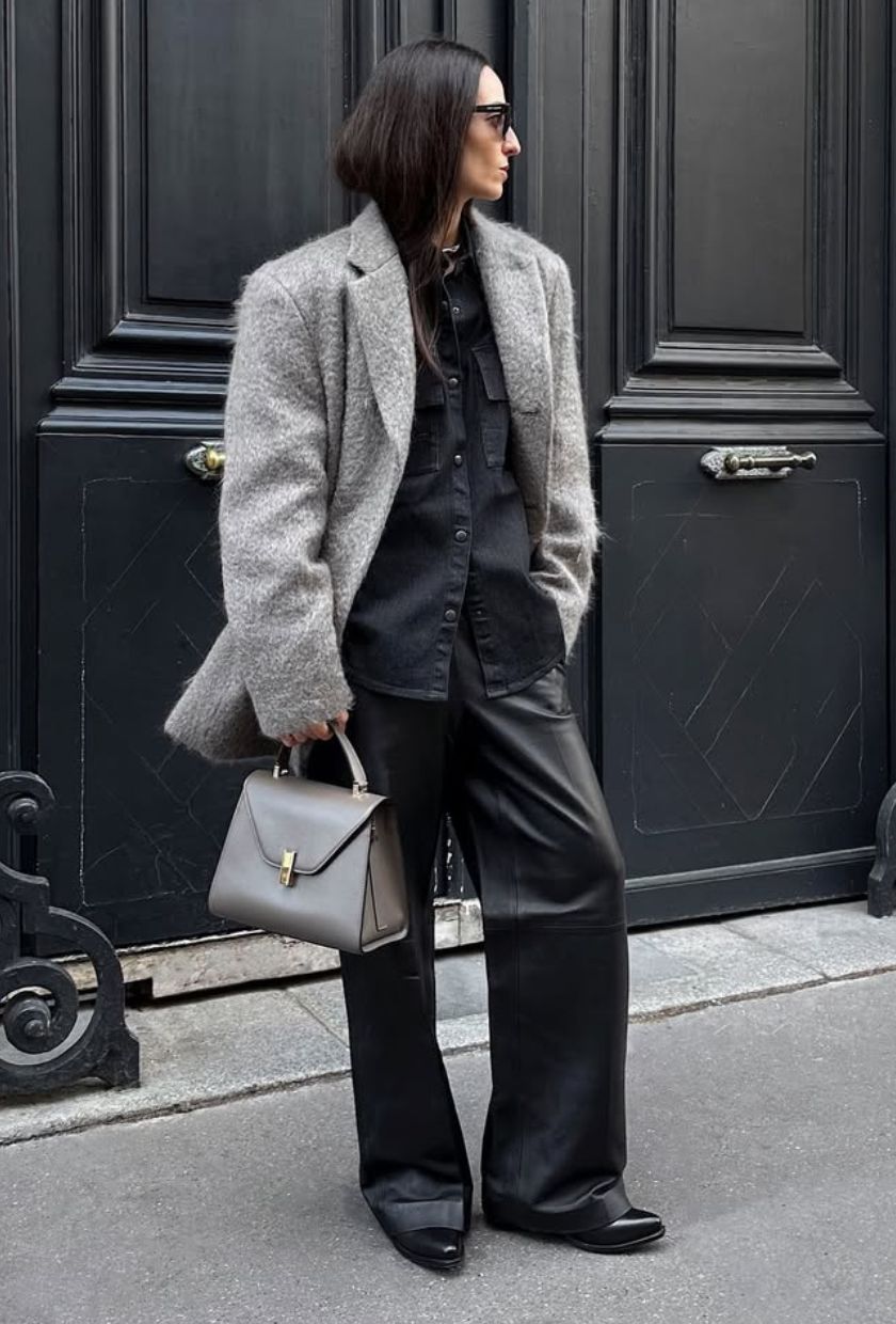 @ileniatoma_ wears a wool blazer, shirt, leather trousers, bag and boots