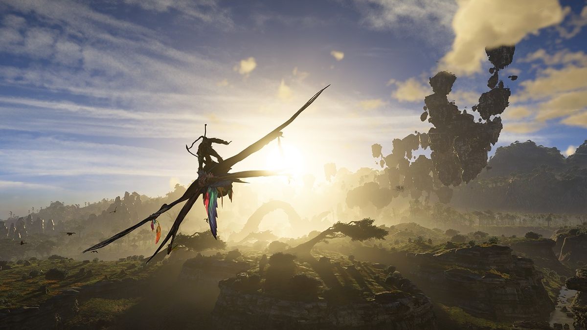 Still from the video game Avatar: Frontiers of Pandora. A Na&#039;vi (blue humanoid with long dark hair) is riding on top of large flying beast off into the sunset.