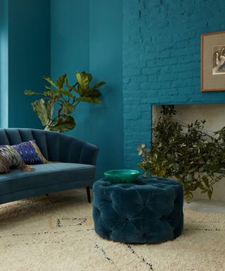 blue living room with painted brick