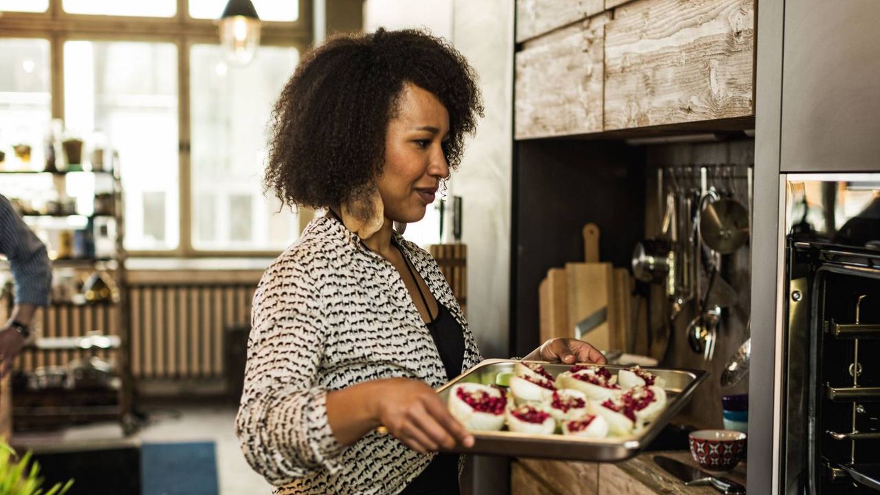 Woman using a NEFF oven 