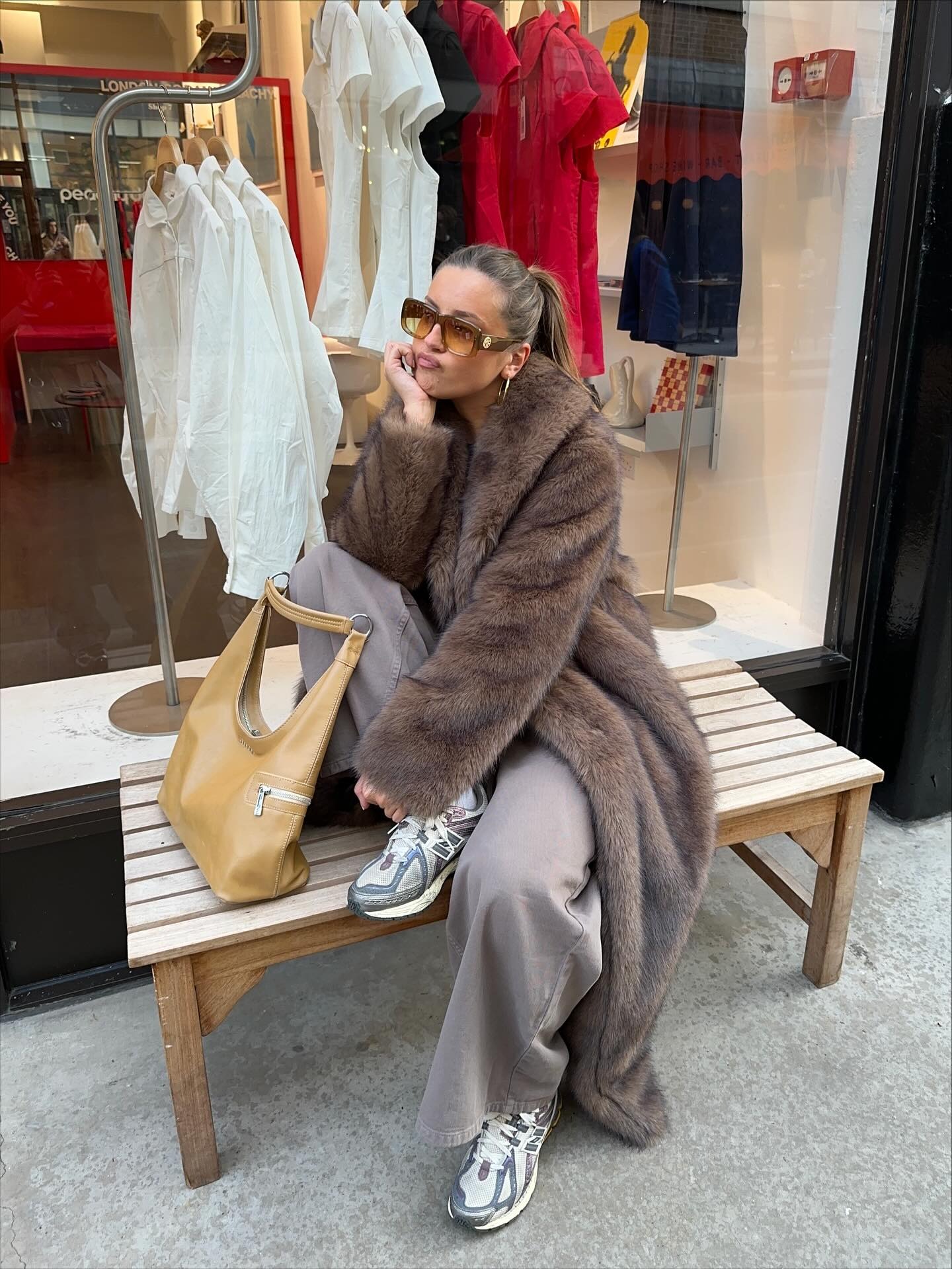 Olivia Grace Herring wears London winter shoe trends. She wears cool dad trainers.