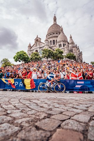 Paris, France - Men’s Road Race - Julian Alaphilippe (France) climbs the Côte De La Butte Montmartre passing crowds outside Basilique du Sacré-Cœur de Montmartre