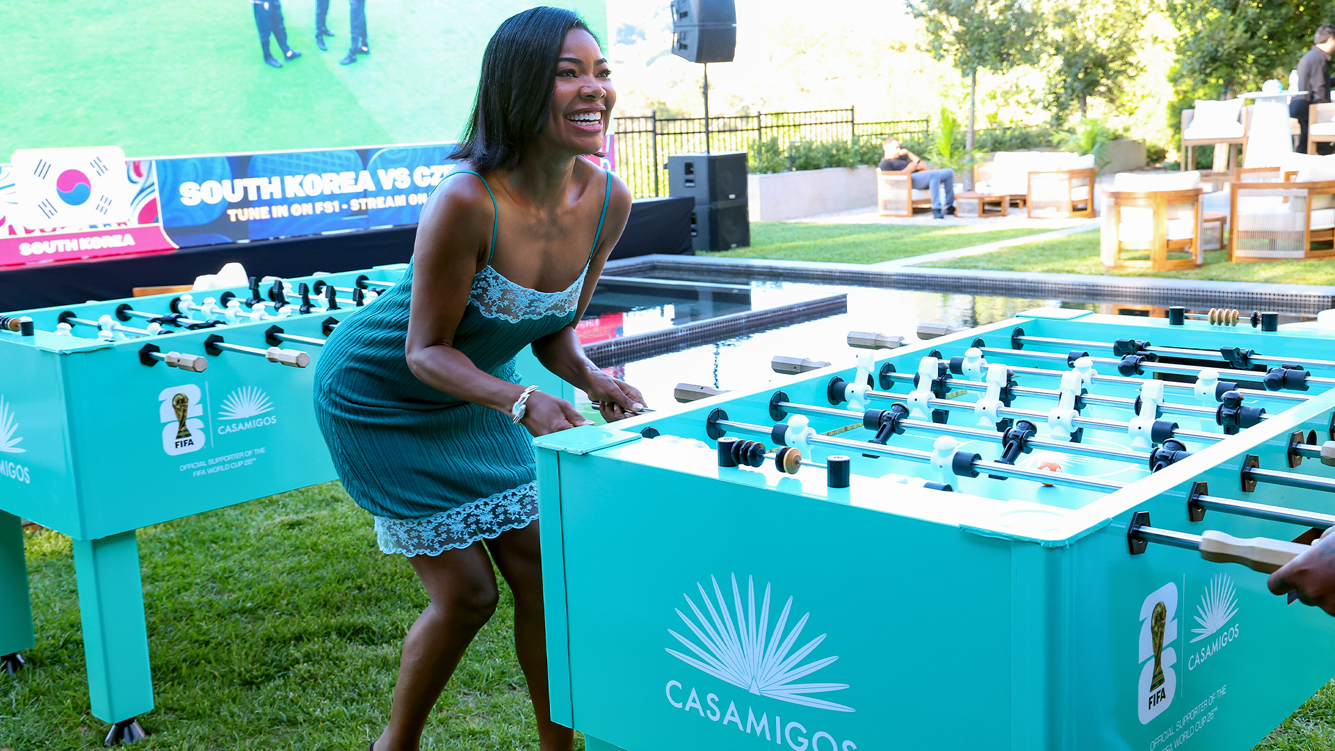 Gabrielle Union poses in teal dress during Casamigos watch party.