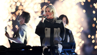 Emily Armstrong, Lead Singer of Linkin Park, preforms, as a pyrotechnical display takes place prior to the UEFA Champions League Final 2025 between Paris Saint-Germain and FC Internazionale Milano at Munich Football Arena on May 31, 2025 in Munich, Germany.