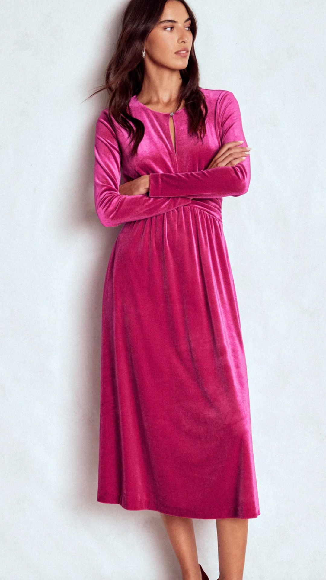a model wearing a pink boden velvet dress
