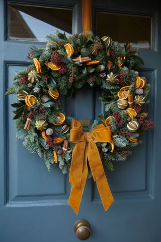 christmas wreath ideas orange wreath on blue door