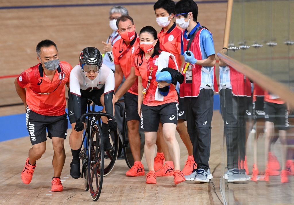 Japans Yumi Kajihara gets back on her bike after crashing in the womens track cycling omnium points race during the Tokyo 2020 Olympic Games at Izu Velodrome in Izu Japan on August 8 2021 Photo by Peter PARKS AFP Photo by PETER PARKSAFP via Getty Images