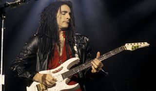 Steve Vai performs onstage in the early '90s