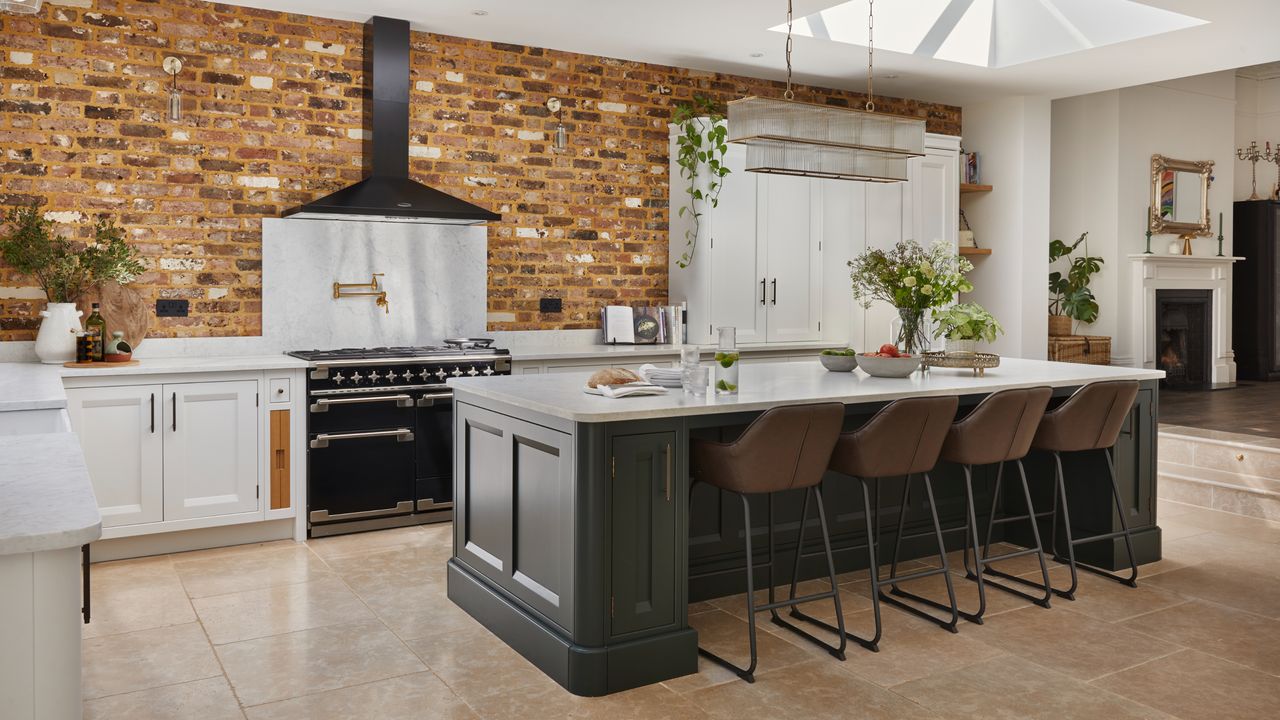 Kitchen with exposed brick wall and pot filler tap