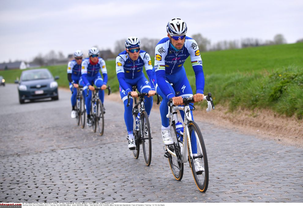 Tom Boonen leads teammate Julien Vermote over the cobbles