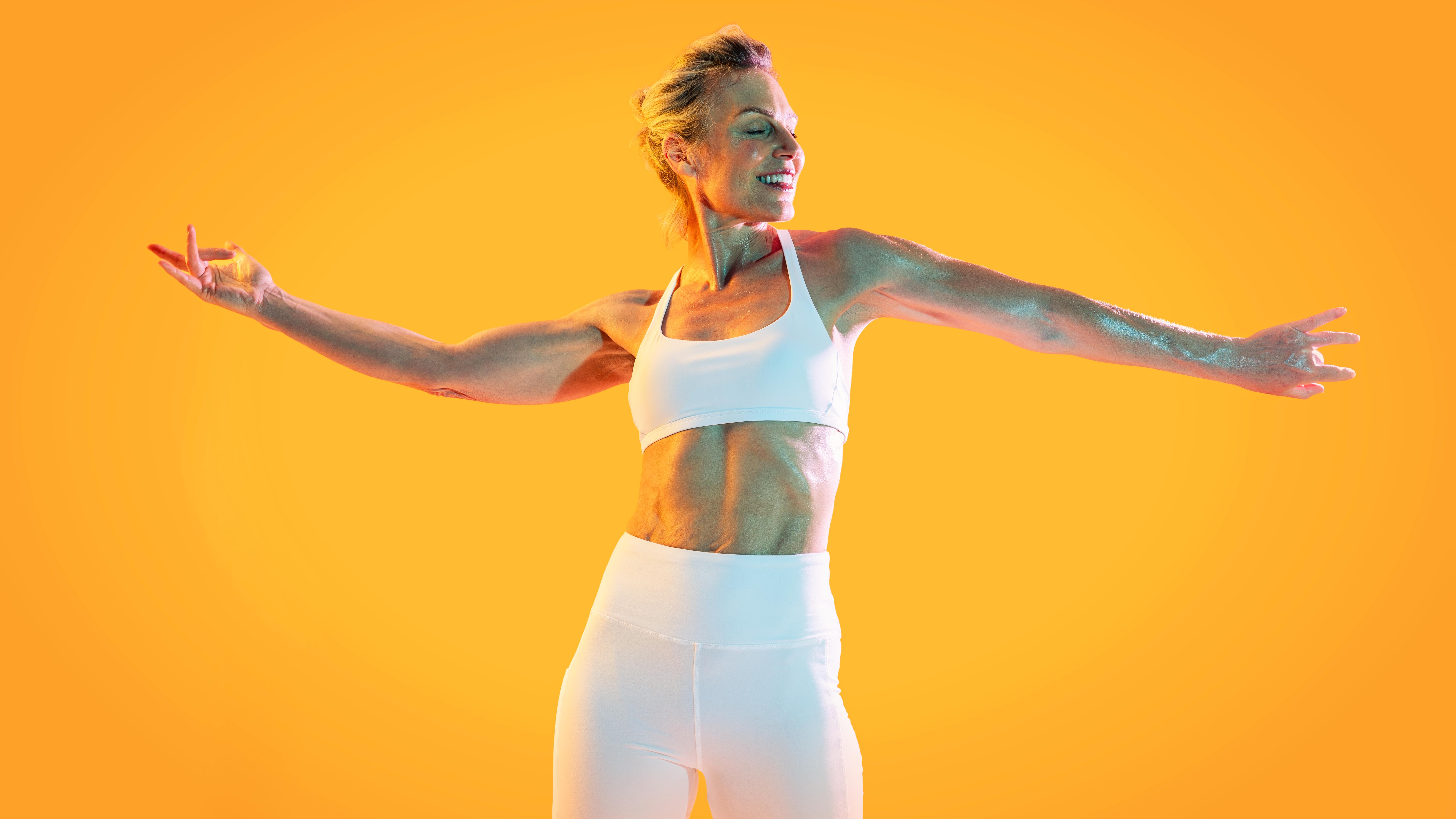 a middle aged woman in workout gear