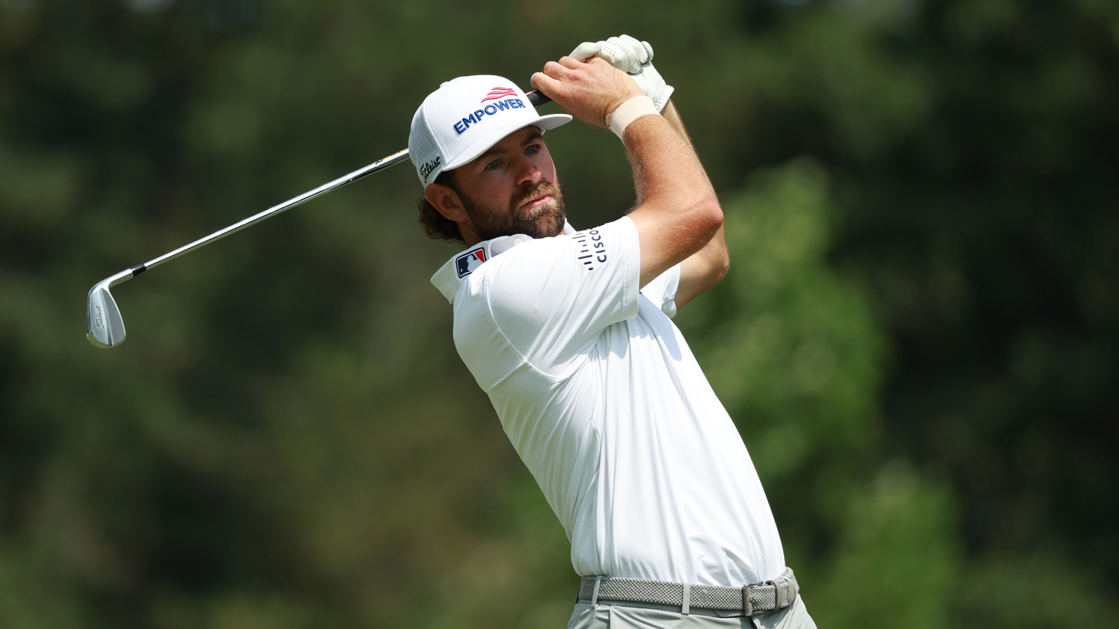 Cameron Young hits an iron shot