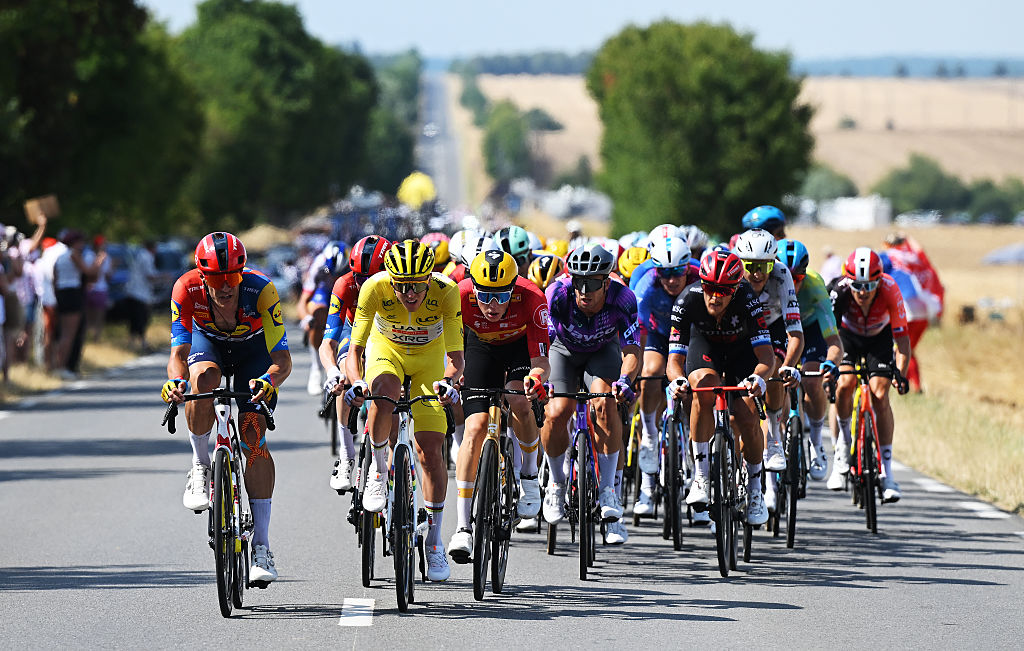 CHATEAUROUX, FRANCE - JULY 13: (L-R) Jasper Stuyven of Belgium and Team Lidl - Trek. Tadej Pogacar of Slovenia and UAE Team Emirates - XRG - Yellow leader jersey and Dylan Groenewegen of Netherlands and Team Jayco AlUla compete during the 112th Tour de France 2025, Stage 9 a 174.1km stage from Chinon to Chateauroux ) / #UCIWT / on July 13, 2025 in Chateauroux, France. (Photo by Dario Belingheri/Getty Images)