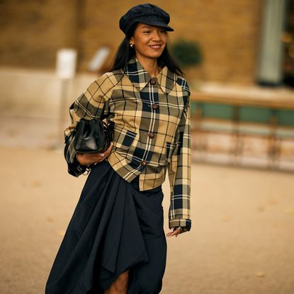 woman wearing a checkered shirt and skirt