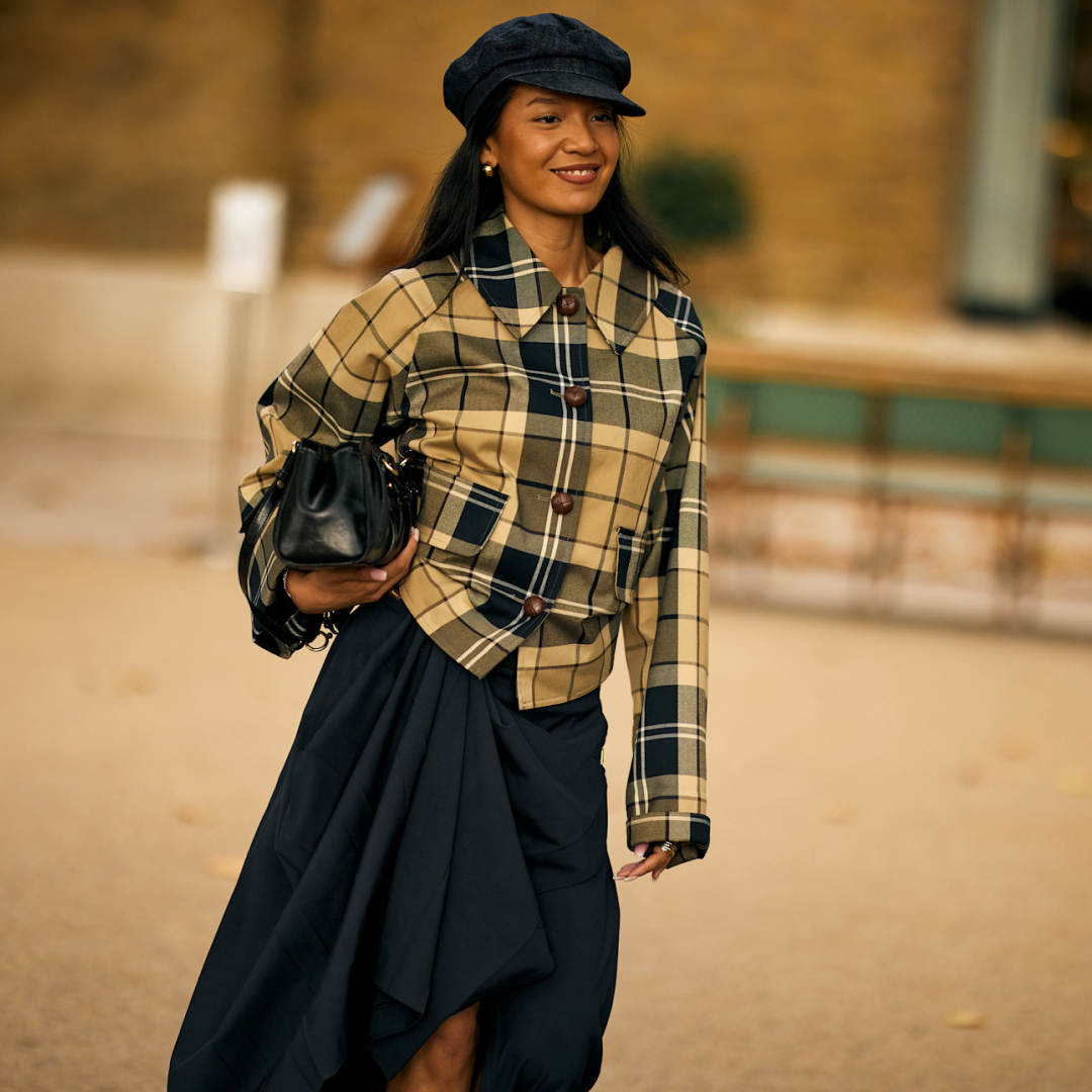 woman wearing a checkered shirt and skirt