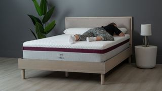 Helix Dusk mattress, with Sleep Editor lying on her front on it