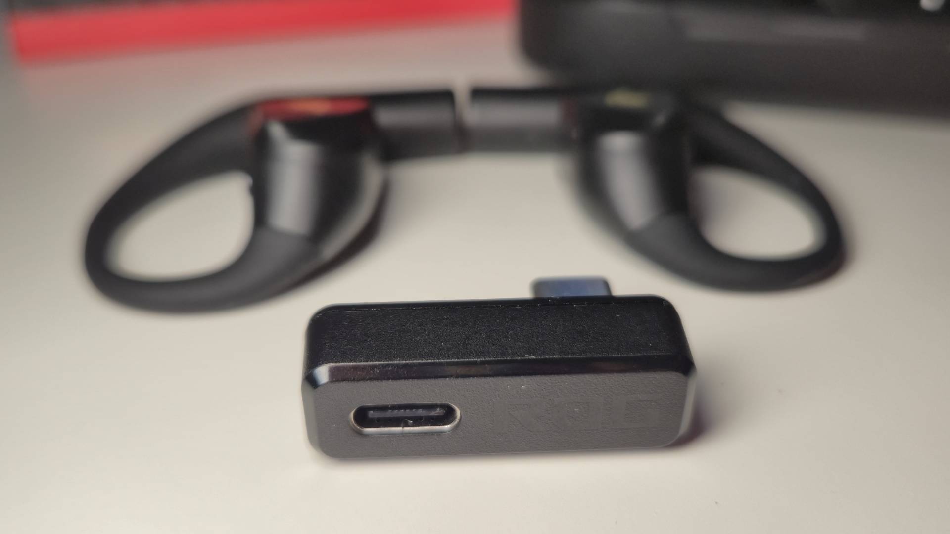 Close up of the 2.4GHz wireless dongle of the Cetra Open Wireless Gaming Earbuds.