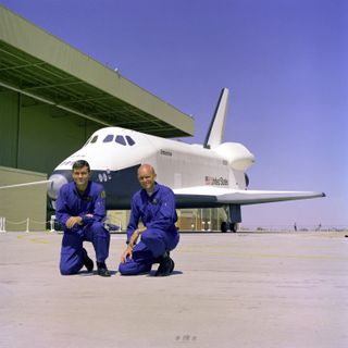 The first crew members for the Space Shuttle Approach and Landing Tests (ALT) are photographed at the Rockwell International Space Division's Orbiter Assembly Facility at Palmdale, California.