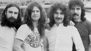 Black Sabbath in black and white, looking at the camera