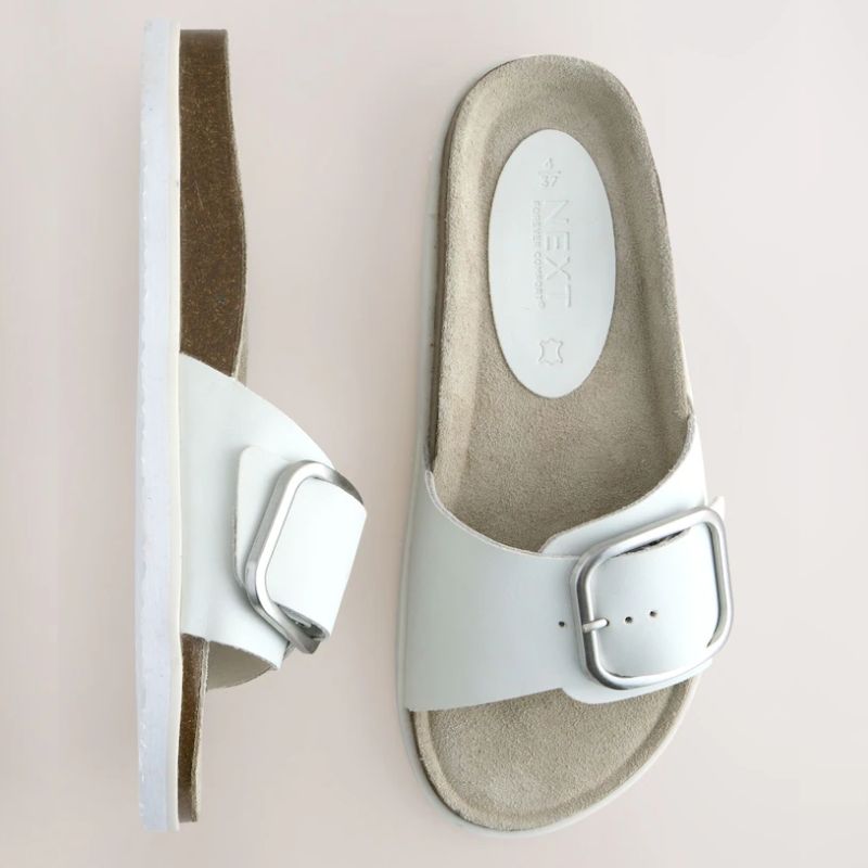 Next, white single strap bucke sandals
