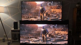 The LG C1 OLED side by side with the LG G1 OLED both displaying a scene from the MCU of Thanos