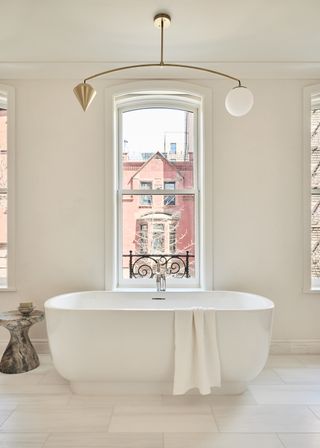 A white bathroom with overhead lighting
