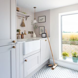 farmhouse with modern extension decorated in shades of grey and white