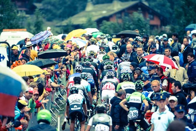 The riders get tightly packed into a bottle neck at the back of the finish line as they attempt to get to their team buses.